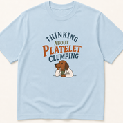 Garment-dyed unisex t-shirt printed with 'Thinking About Platelet Clumping' — Hematology humor tee for Internal Medicine, Laboratory Medicine, and Pathology professionals.
