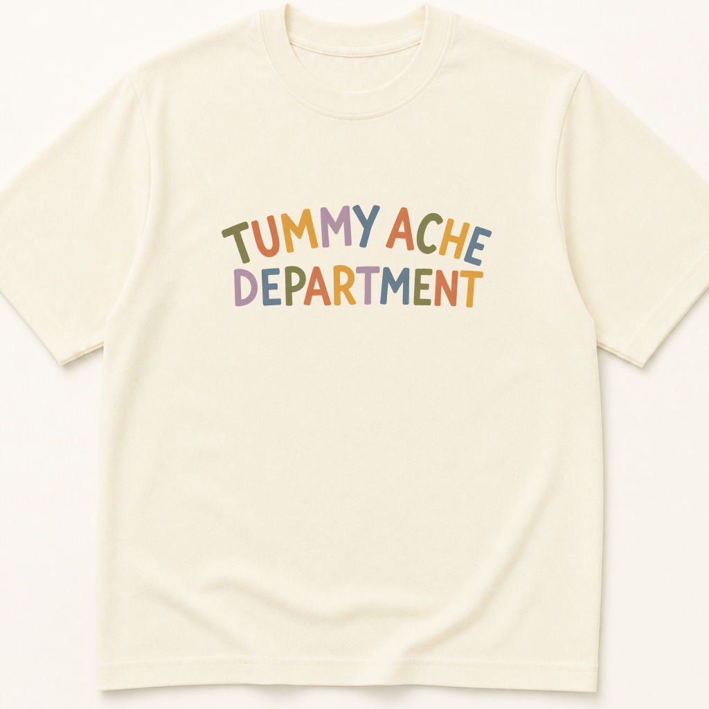 Garment-dyed unisex t-shirt printed with 'Tummy Ache Department' — Family Medicine humor tee for Gastroenterology and Pediatrics professionals.
