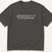 Garment-dyed unisex t-shirt printed with 'Gatekeeper of Carbapenems' — Infectious Disease humor tee for Internal Medicine and Pharmacy professionals.