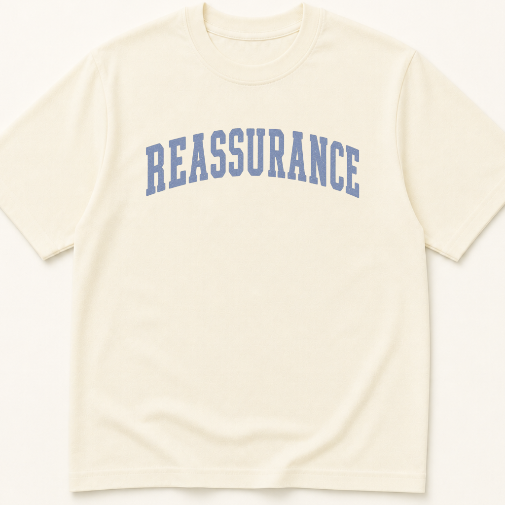 Garment-dyed unisex t-shirt printed with 'Reassurance' — Family Medicine humor tee for Internal Medicine, Nursing, and Primary Care professionals.