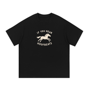Mockup of black cotton T-shirt with a galloping horse with the words "If you hear hoofbeats".