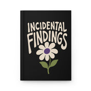 Front cover of a black hardcover journal with cream lettering reading 'Incidental Findings' above a cream daisy
