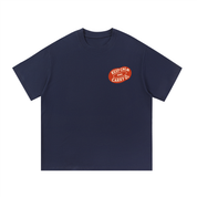 Mockup of a navy blue cotton T-shirt with a small red oval graphic reading 'Keep Calm and Carry O2'