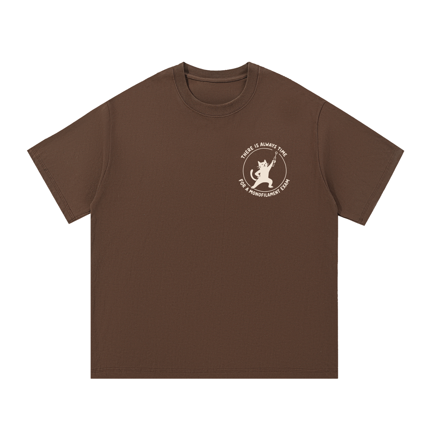 Mockup of coffee cotton T-shirt with a cat holding a pin next to the words "There is always time for a monofilament exam".