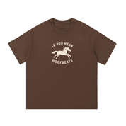 Mockup of navy blue cotton T-shirt with a galloping horse with the words "If you hear hoofbeats".