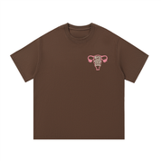 Mockup of a coffee brown cotton T-shirt with a pink uterus and the text 'girls just wanna have fundus'