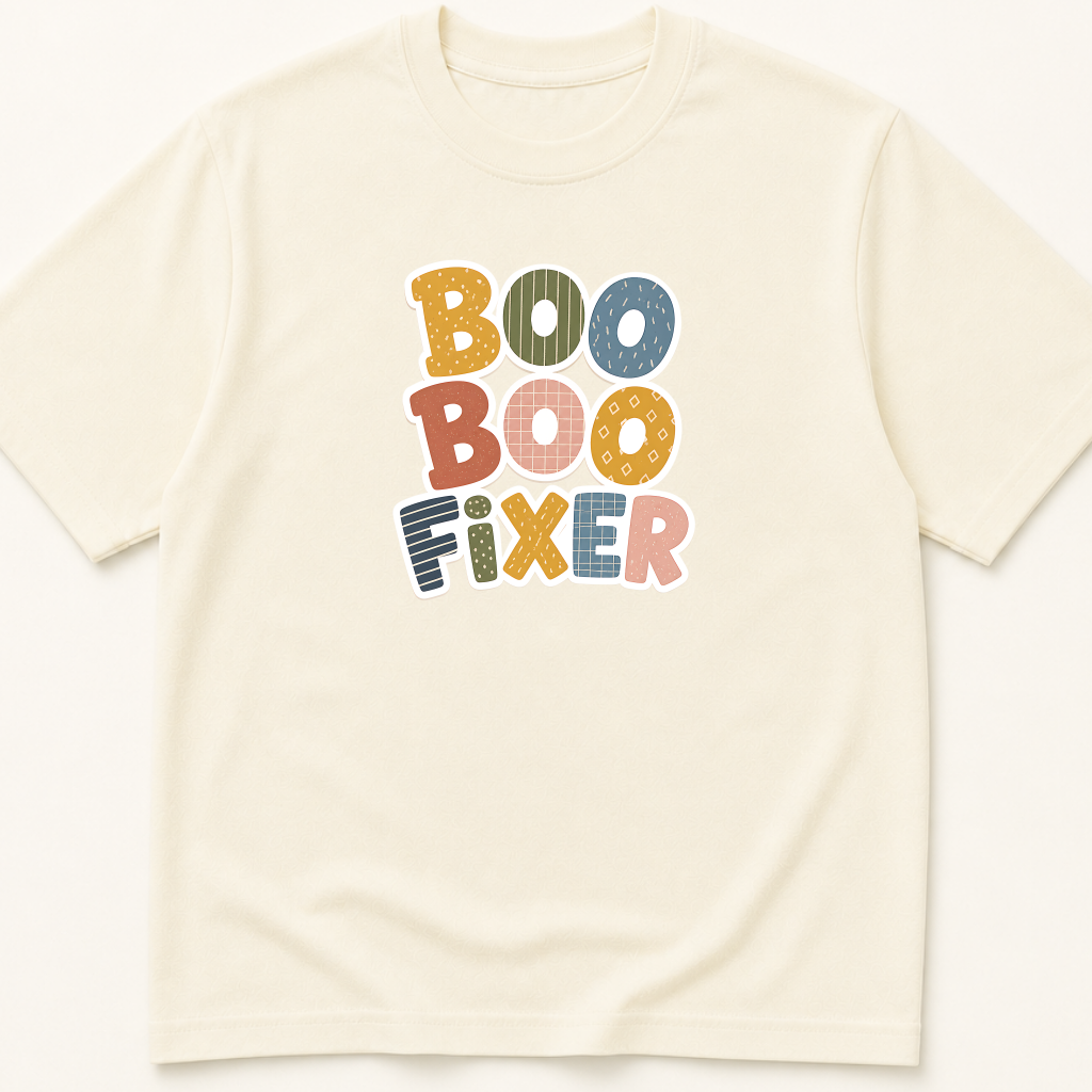 Garment-dyed unisex t-shirt printed with 'Boo Boo Fixer' — Emergency Medicine humor tee for Family Medicine, Nursing, and Pediatrics professionals.