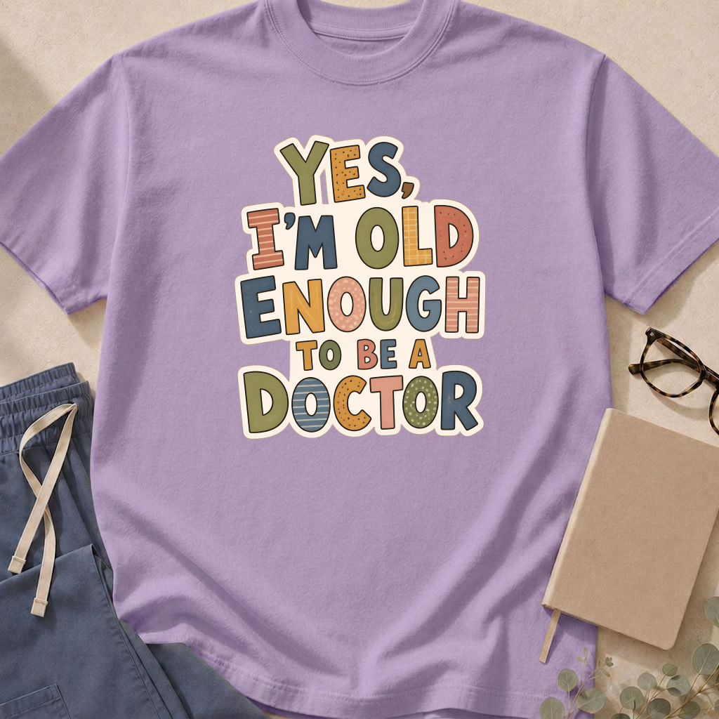Alternate view of the 'Yes, I'm Old Enough to Be a Doctor' garment-dyed t-shirt in the Orchid colorway.