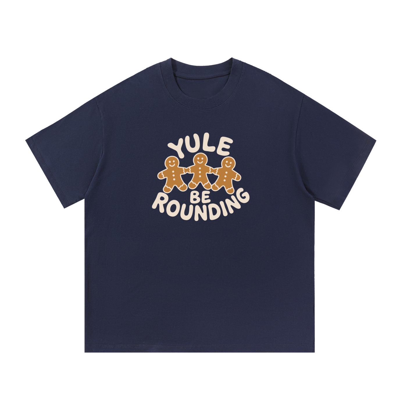 Mockup of a navy blue cotton T-shirt with three gingerbread men holding hands and the words 'Yule Be Rounding'