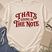 Garment-dyed unisex t-shirt printed with "That's Going in the Note" — hospital medicine humor tee for physicians and residents
