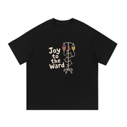 Mockup of a black cotton T-shirt with 'Joy to the Ward' beside an IV pole wrapped in holiday lights