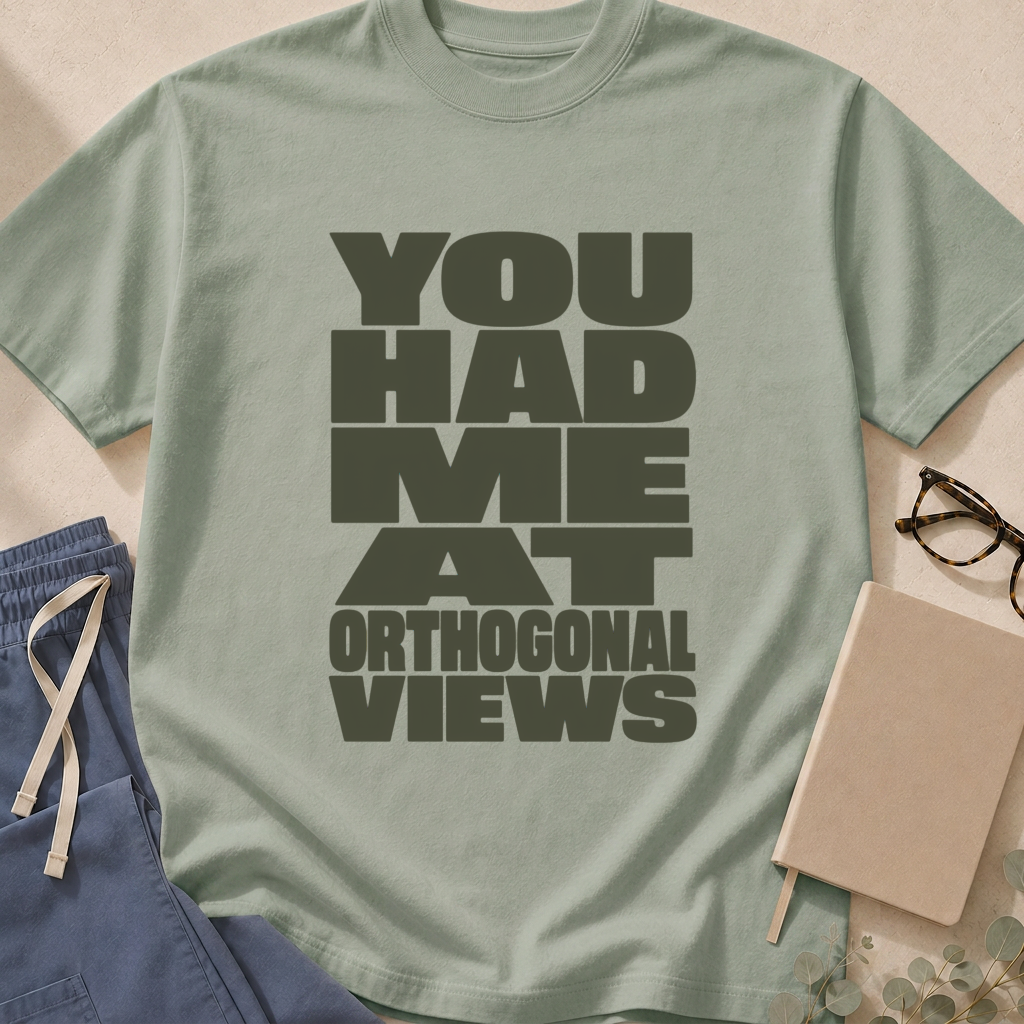 Garment-dyed unisex t-shirt printed with "You Had Me At Orthogonal Views" — radiology humor tee