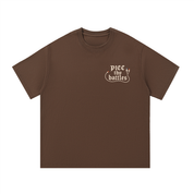Mockup of navy blue cotton T-shirt with gothic script reading "PICC thy battles".