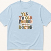 Alternate view of the 'Yes, I'm Old Enough to Be a Doctor' garment-dyed t-shirt.