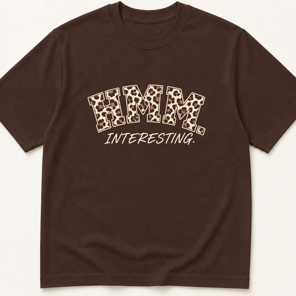 Garment-dyed unisex t-shirt printed with 'Hmm, Interesting' — General Medicine humor tee for Internal Medicine, Pathology, and Radiology professionals.