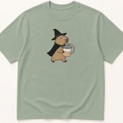 Alternate view of the illustrated Capybara in Witch Costume Holding a Suction Canister garment-dyed t-shirt.