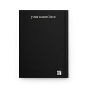 Back cover of a black hardcover journal with 'your name here' in cream text and a small production barcode
