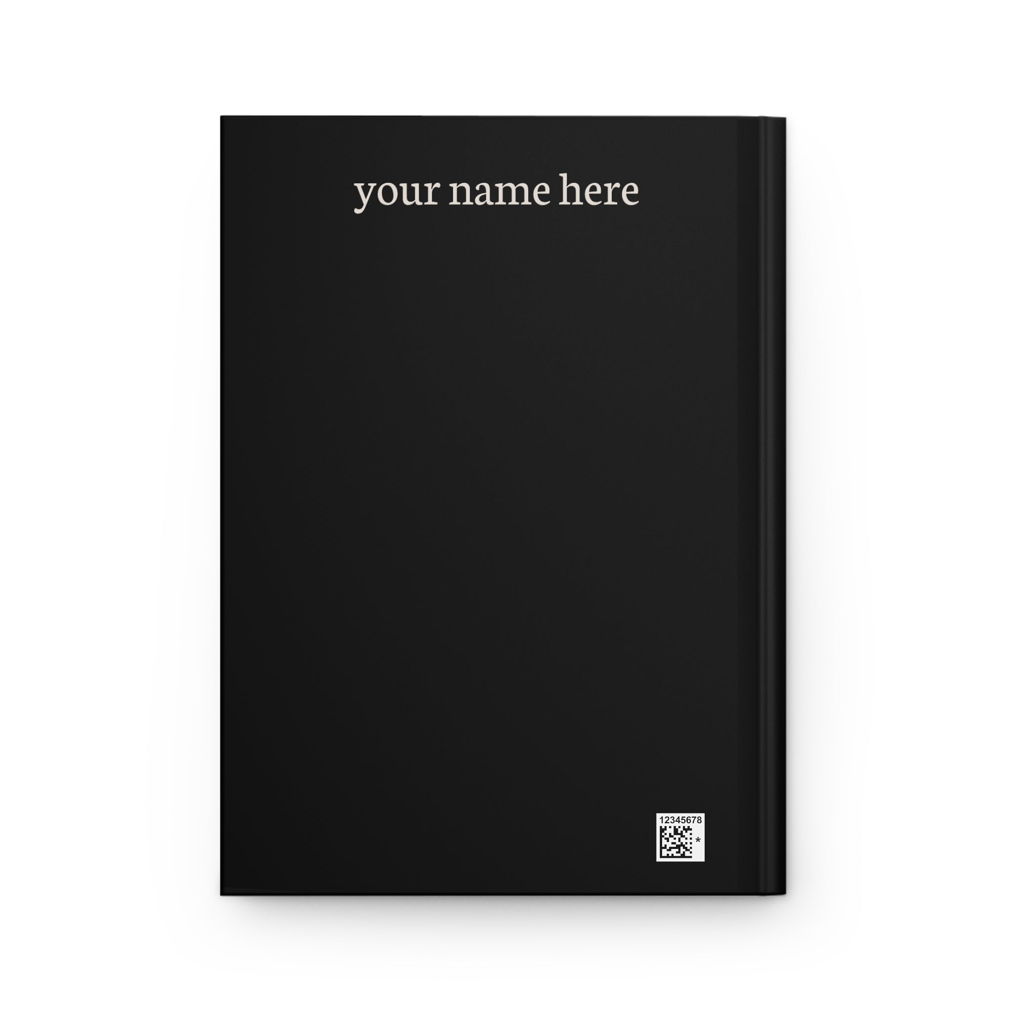 Back cover of a black hardcover journal with 'your name here' in cream text and a small production barcode