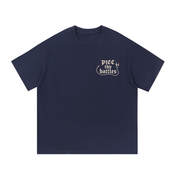 Mockup of coffee cotton T-shirt with gothic script reading "PICC thy battles".