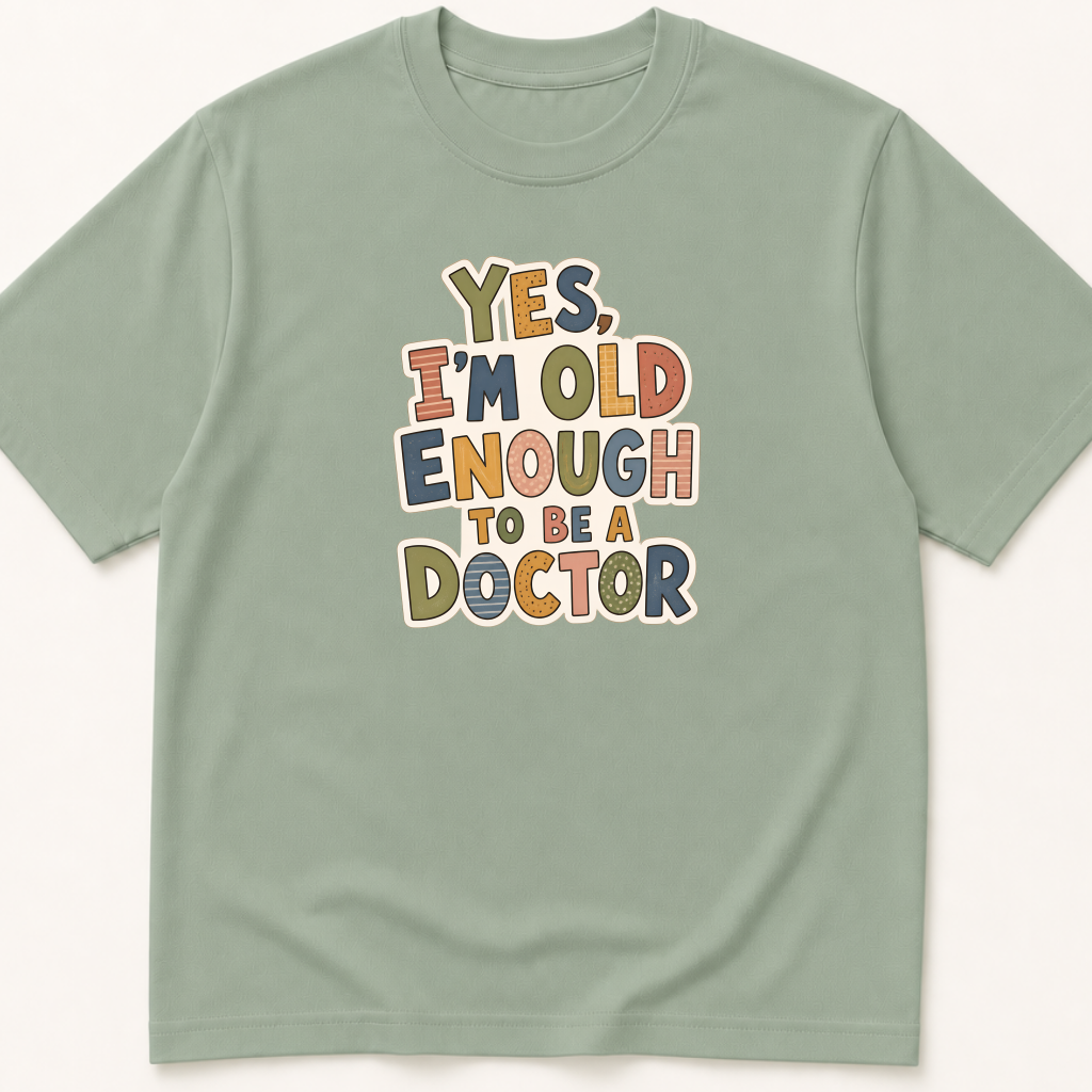 Alternate view of the 'Yes, I'm Old Enough to Be a Doctor' garment-dyed t-shirt.