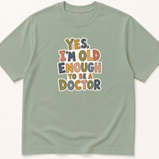 Alternate view of the 'Yes, I'm Old Enough to Be a Doctor' garment-dyed t-shirt.