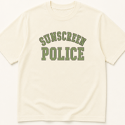 Garment-dyed unisex t-shirt printed with 'Sunscreen Police' — Dermatology humor tee for Family Medicine, Pediatrics, and Preventive Medicine professionals.