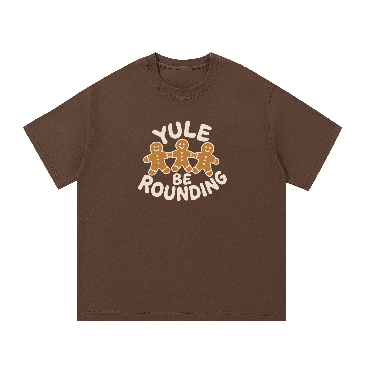 Mockup of a coffee brown cotton T-shirt with three gingerbread men holding hands and the words 'Yule Be Rounding'