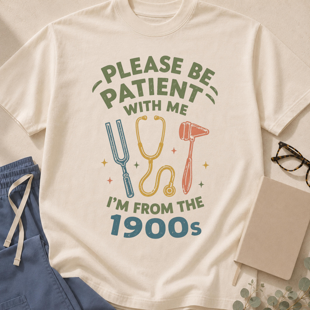 Garment-dyed unisex t-shirt printed with "Be Patient With Me I'm From the 1900s" — geriatrics humor tee
