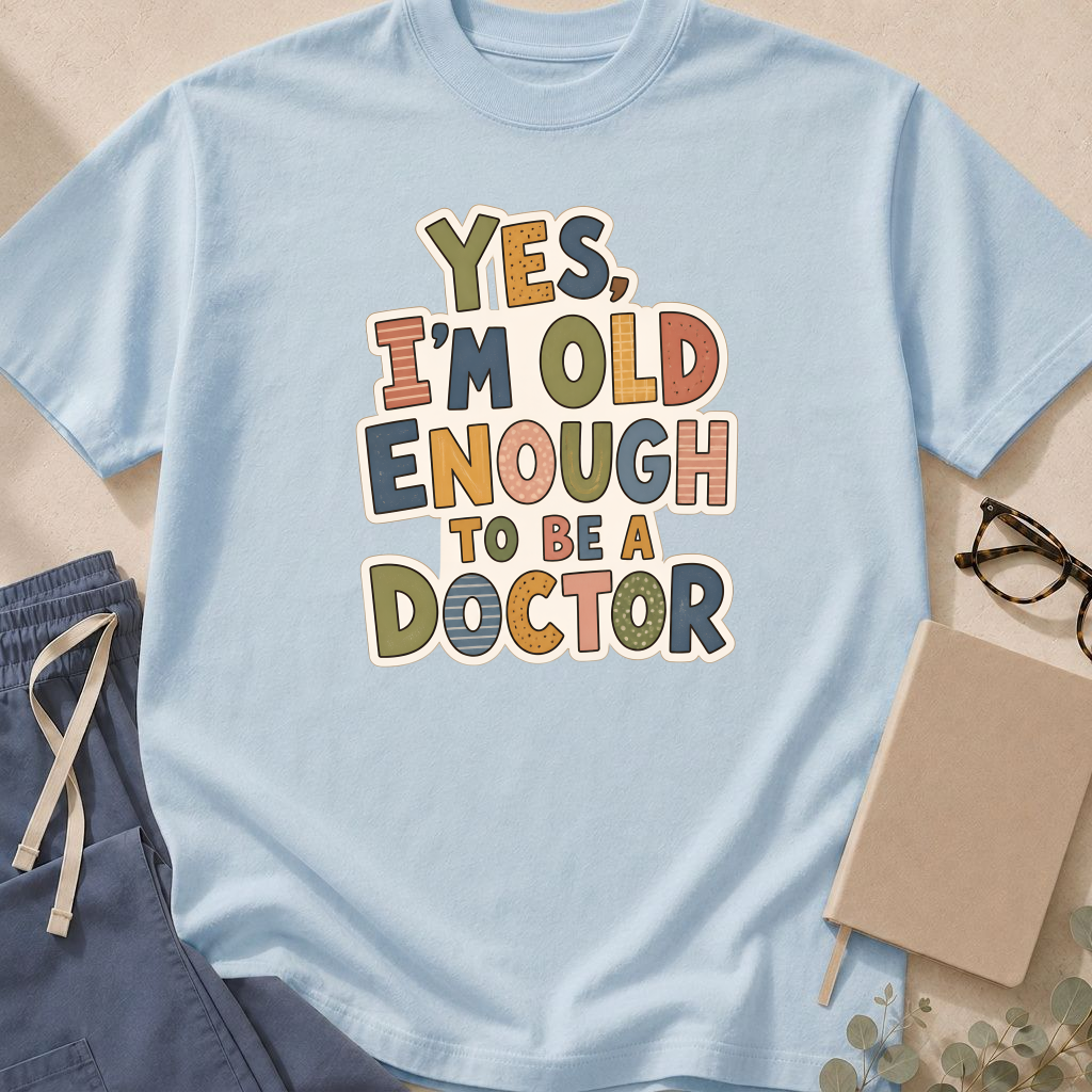 Alternate view of the 'Yes, I'm Old Enough to Be a Doctor' garment-dyed t-shirt in the Ivory colorway.