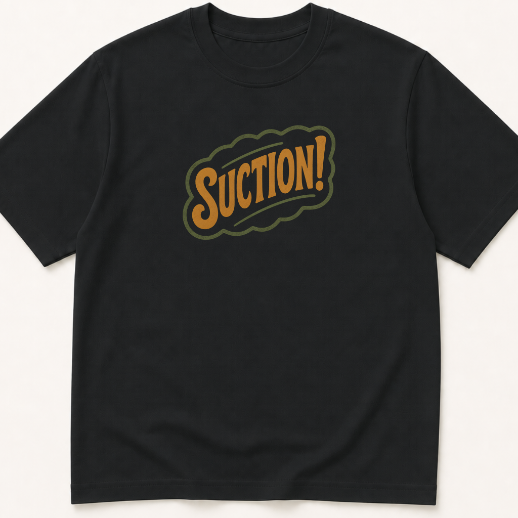 Garment-dyed unisex t-shirt printed with 'Suction!' — Anesthesiology humor tee for Nursing, Surgery, and Surgical Technology professionals.