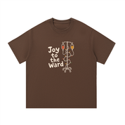 Mockup of a coffee-brown cotton T-shirt with 'Joy to the Ward' beside an IV pole wrapped in holiday lights