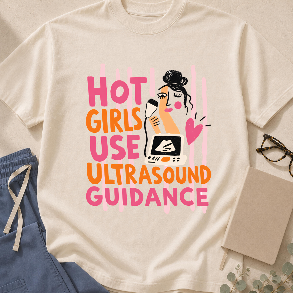 Garment-dyed unisex t-shirt printed with 'Hot Girls Use Ultrasound Guidance' — vascular access humor tee for anesthesiologists, ER staff, and ultrasound techs.