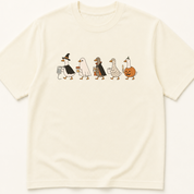 Garment-dyed unisex t-shirt featuring an illustrated Geese in Halloween Costumes Holding Medical Items design — General Medicine humor tee for Nursing professionals.