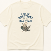 Garment-dyed unisex t-shirt printed with 'I Have Questions for the Day Team' — Critical Care humor tee for Emergency Medicine, Hospital Medicine, and Internal Medicine professionals.