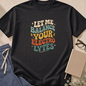 Garment-dyed unisex t-shirt printed with 'Let Me Balance Your Electrolytes' — nephrology and critical care humor tee.