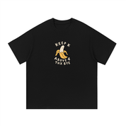 Mockup of black cotton T-shirt with a peeled banana with the words "Keep K above 4, thx bye".