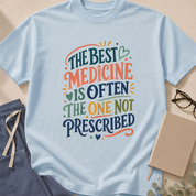Detail view of the 'The Best Medicine is Often the One Not Prescribed' garment-dyed primary care t-shirt.