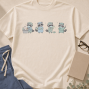 Garment-dyed unisex t-shirt featuring an illustrated raccoon scrubbing in for surgery — operating room humor tee for surgeons and surgical techs.