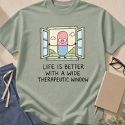 Garment-dyed unisex t-shirt printed with 'Life Is Better With a Wide Therapeutic Window' — pharmacology and pharmacokinetics humor tee for pharmacists and clinicians.